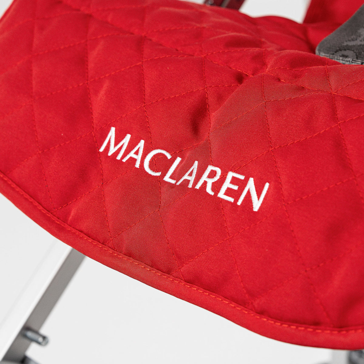 Red Maclaren Major Elite padded seat liner, front view