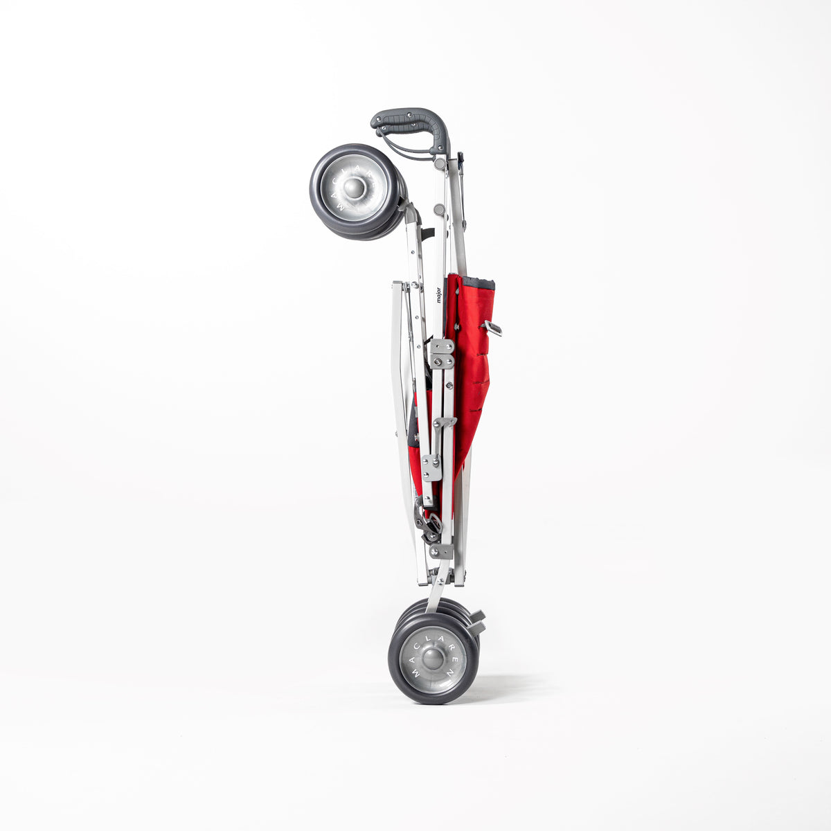 Red Maclaren Major Elite special needs stroller folded for transport